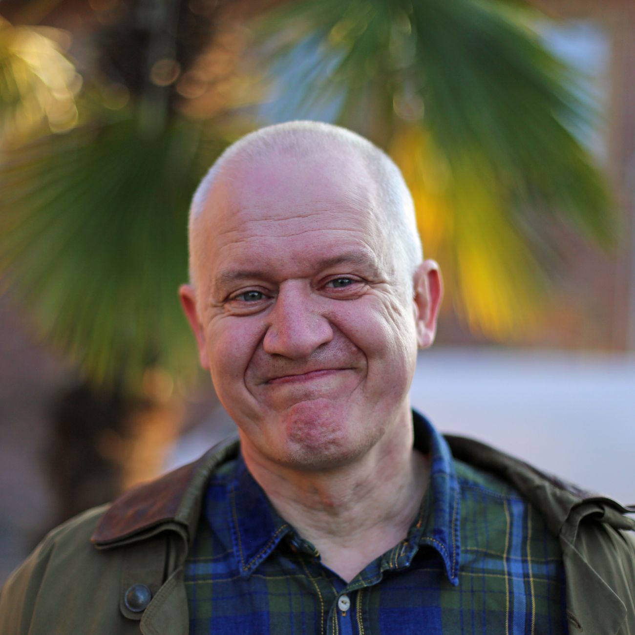 Smiling bald man outdoors